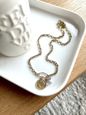 collier poisson astro medaillon amethyste